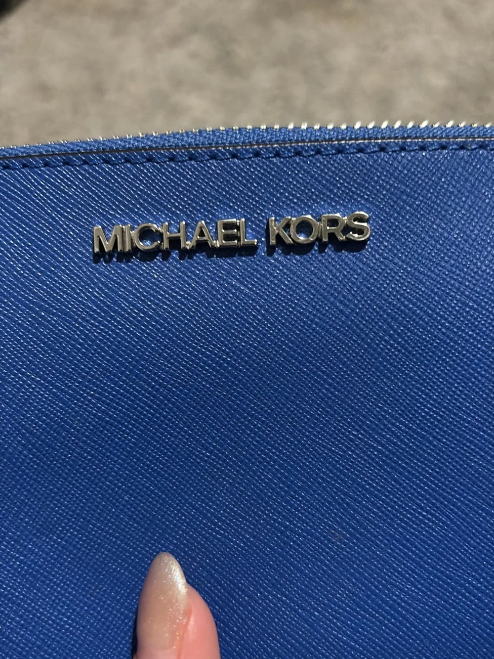 Michael Kors Adele Double-Zip Wristlet in a bright blue